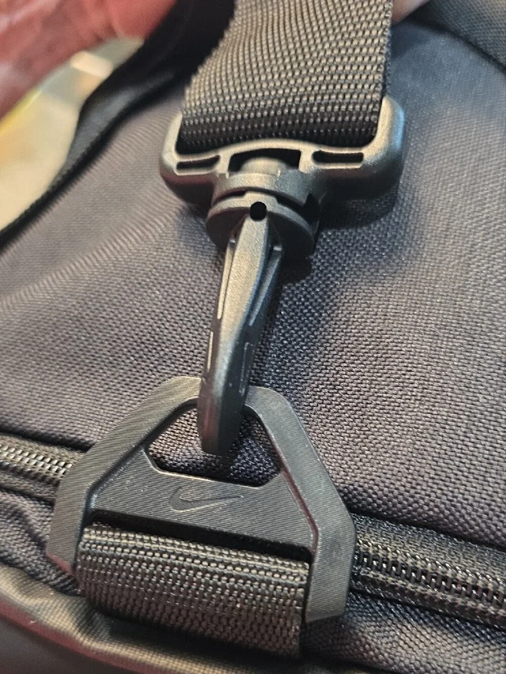 Nike Black Duffel Bag with White Swoosh and Branded Strap